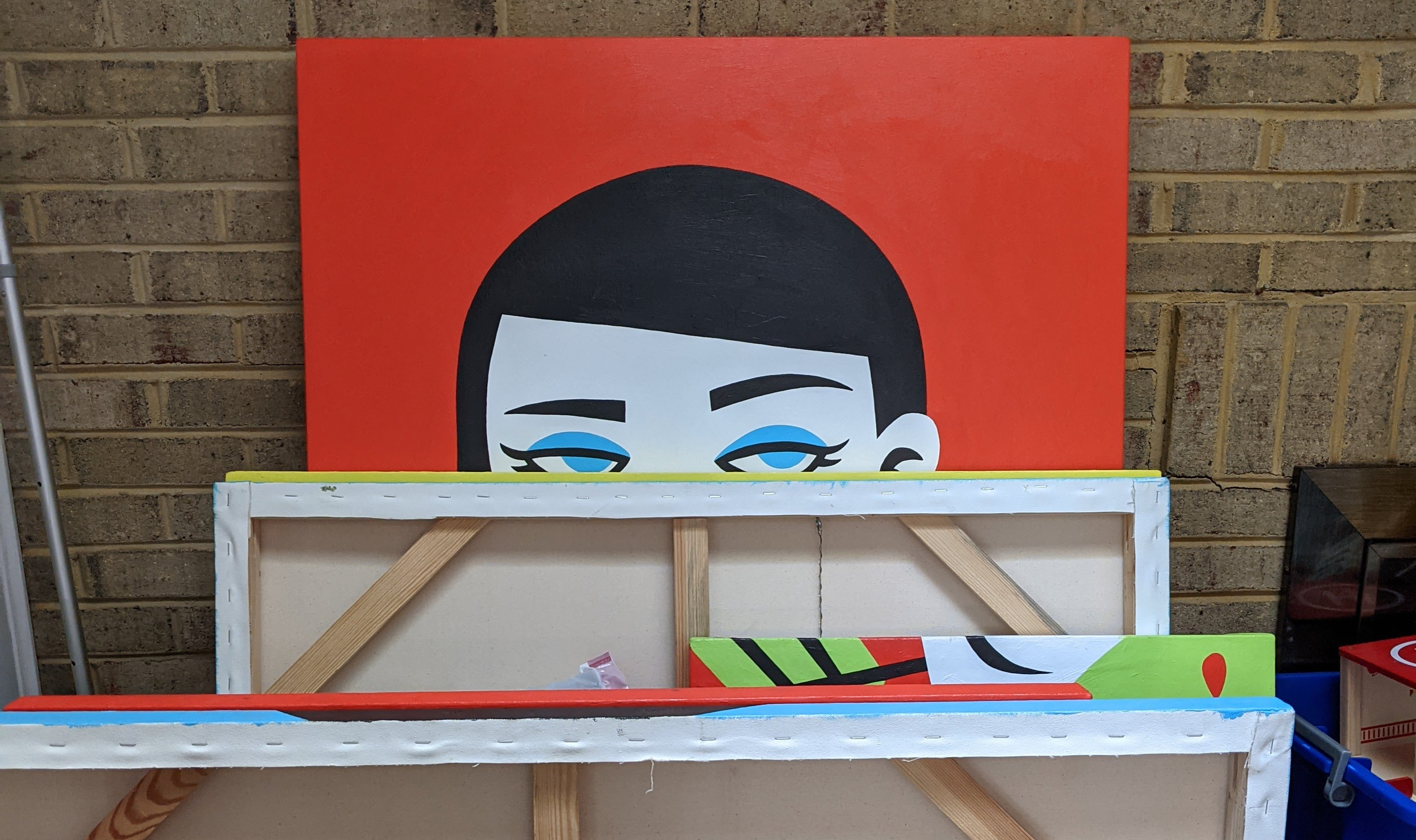 Pop art painting of a girl's eyes peeking over a ledge, bold red background